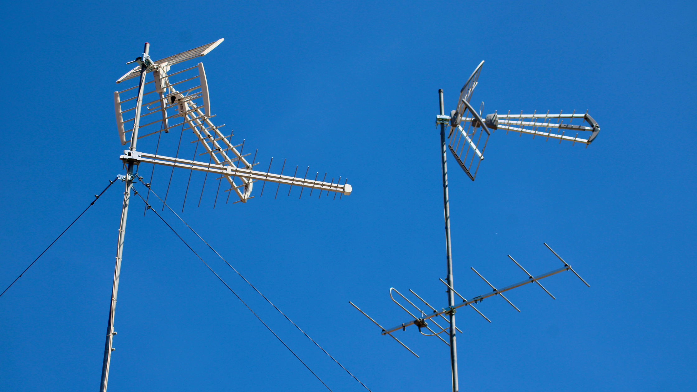 Rooftop TV antennas in Australia that may be affected by 5G interference and require repair or replacement for stable digital reception.