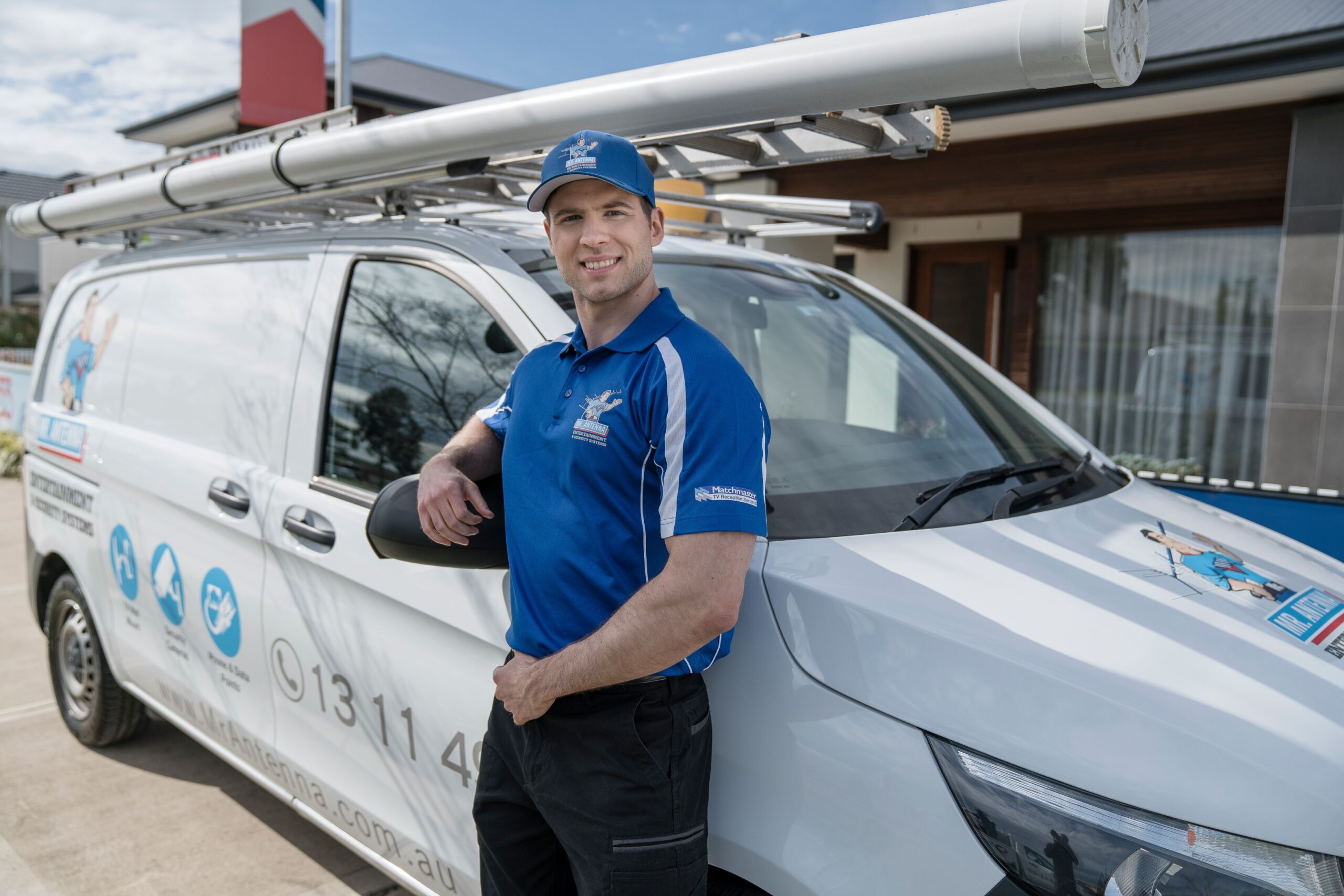 Mr Antenna technician standing beside service van before a TV antenna installation in Perth