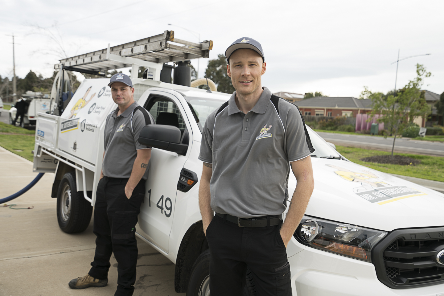 Professional gutter cleaning team using advanced vacuum equipment to clear blocked gutters safely and effectively.